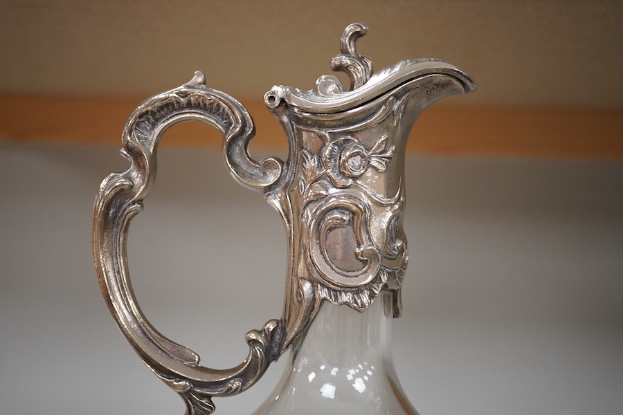 A pair of Art Nouveau style glass and silver plate mounted claret jugs, 31cm. Condition - good